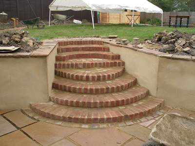 New semi-circular steps leading to the lawn before planting